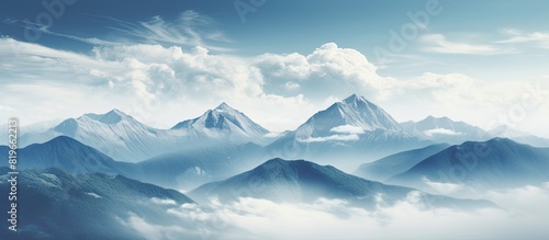 Mountain landscape with an Instagram filter showcasing cloud covered peaks in the background ideal for a copy space image