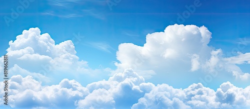 Background featuring a picturesque blue sky with clouds and copy space image