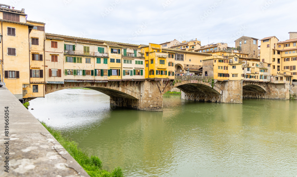 Florence, Italy - April 10, 2024: View of the Vecchio Bridge in Florence with tourists crowding its surroundings in Florence, Italy Florence, Italy - April 10, 2024: View of the Vecchio Bridge in Florence with tourists crowding its surroundings in Florence, Italy