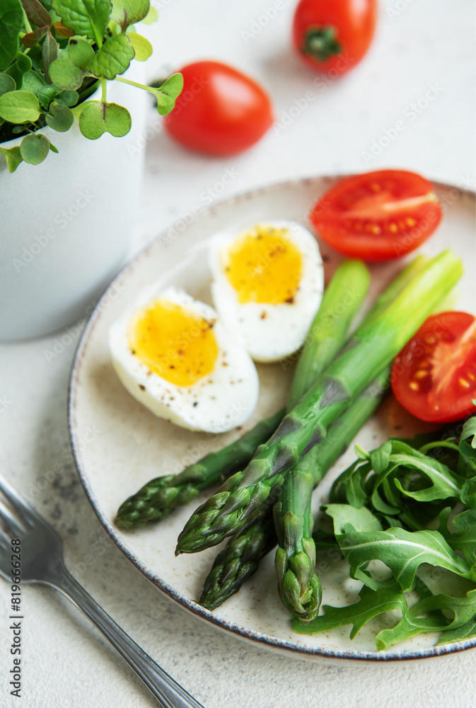 Fresh Spring Salad With Boiled Eggs, Asparagus, and Tomatoes on a Bright Day Fresh Spring Salad With Boiled Eggs, Asparagus, and Tomatoes on a Bright Day