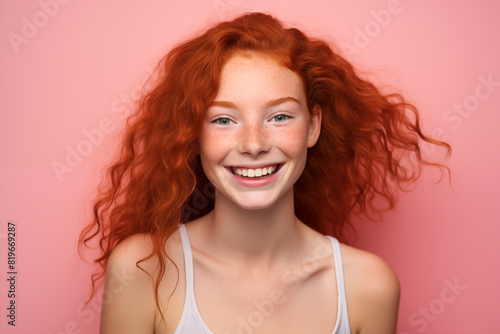 Young pretty Redhead girl over colorful background