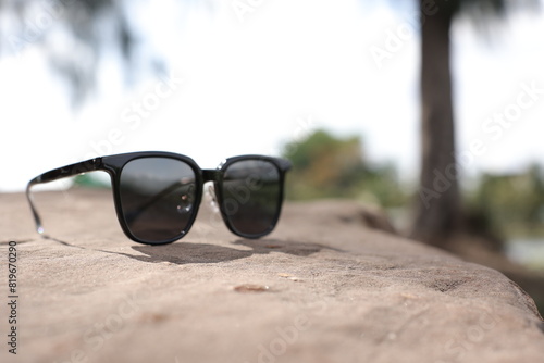 sunglasses on the beach © komthong wongsangiam
