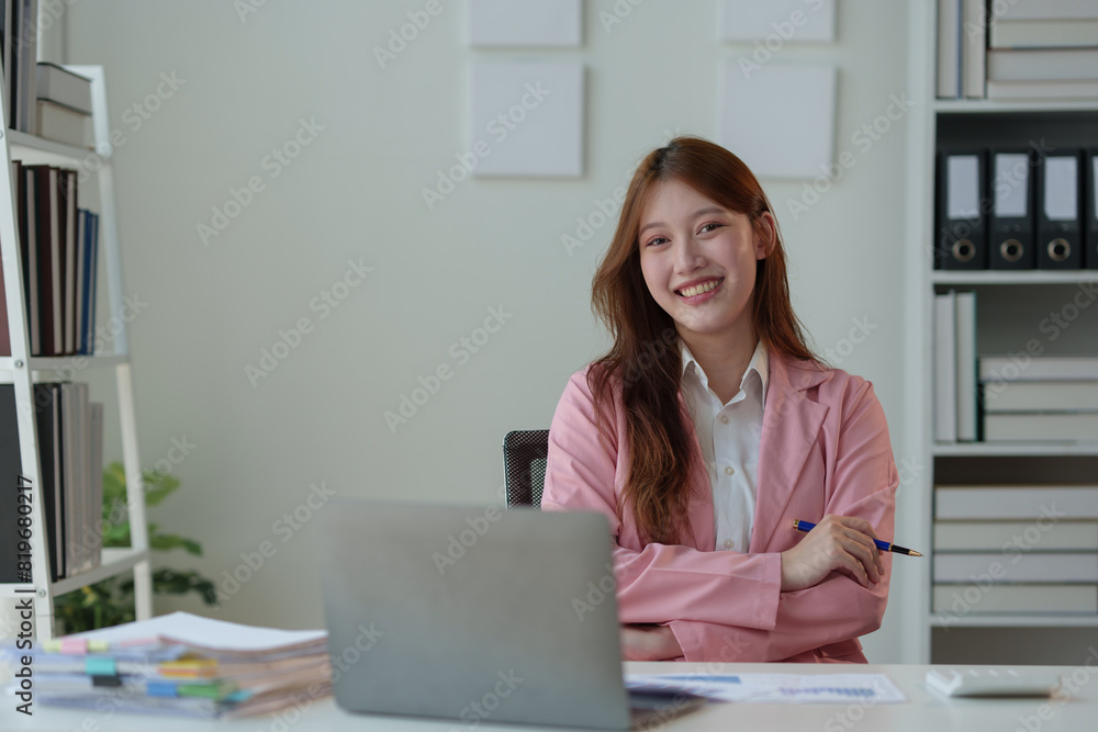 Asian businesswoman working in office with documents and laptop financial documents Sit in your office chair, smile and be happy with your success and results. Ideas for working. Asian businesswoman working in office with documents and laptop financial documents Sit in your office chair, smile and be happy with your success and results. Ideas for working.