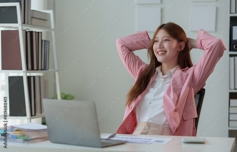 Successful Business Lifestyle Ideas Businesswoman holds her arms behind her head to stretch her muscles after a hard day's work. Long periods of time in the new project office in a relaxed manner. Successful Business Lifestyle Ideas Businesswoman holds her arms behind her head to stretch her muscles after a hard day's work. Long periods of time in the new project office in a relaxed manner.
