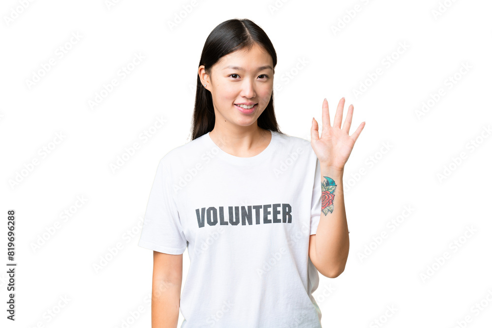 Young volunteer woman over isolated chroma key background saluting with hand with happy expression Young volunteer woman over isolated chroma key background saluting with hand with happy expression
