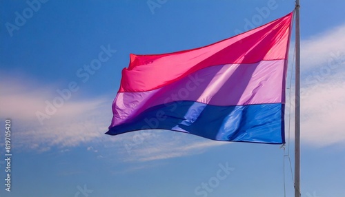 bisexual flag fluttering against blue sky, lgbt pride month © Arthur