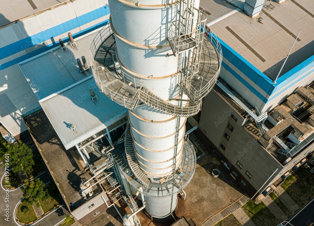 Staircase leading up the side of an industrial chimney in a thermal power plant Staircase leading up the side of an industrial chimney in a thermal power plant