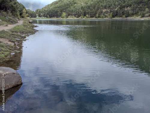 mirror lake inside the forest. Engolasters Lake, Andorra. photo