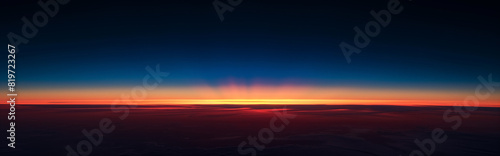 A beautiful sunset, Horizon line banner on dark black background with a gradient from deep navy to vibrant orange. Sunset, sunrise with copy space for text.