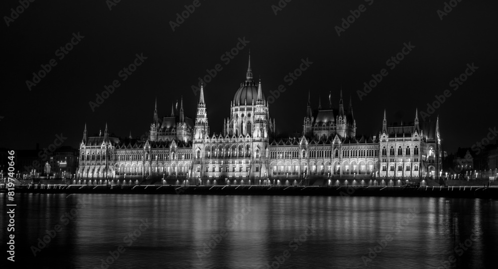 a castle in black and white in the night sky with lights on a castle in black and white in the night sky with lights on
