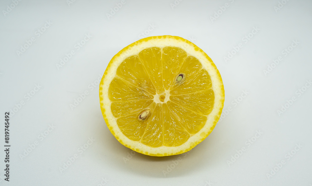 a half cut lemon on a table with its skin cut off a half cut lemon on a table with its skin cut off