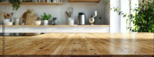 Blurred empty kitchen table with wood countertop and modern interior in the background. Space for product display or montage of home decor, furniture and furnishings. Banner mockup template.