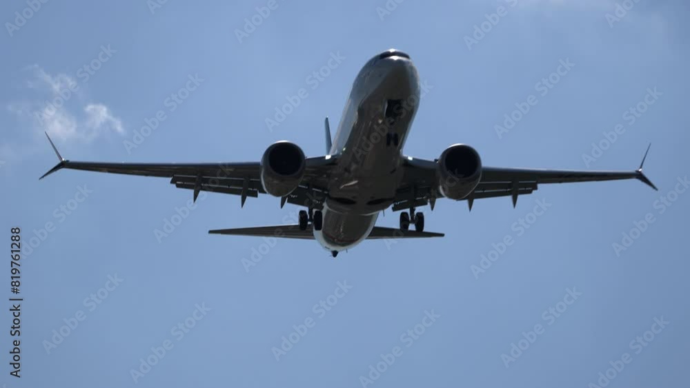 Uzbekistan, Tashkent - may 18, 2024. Boeing 737- max 8 Fly Dubai. Cinematic footage of the approach , the plane comes in for landing against the background of a blue cloudy sky. Uzbekistan, Tashkent - may 18, 2024. Boeing 737- max 8 Fly Dubai. Cinematic footage of the approach , the plane comes in for landing against the background of a blue cloudy sky.