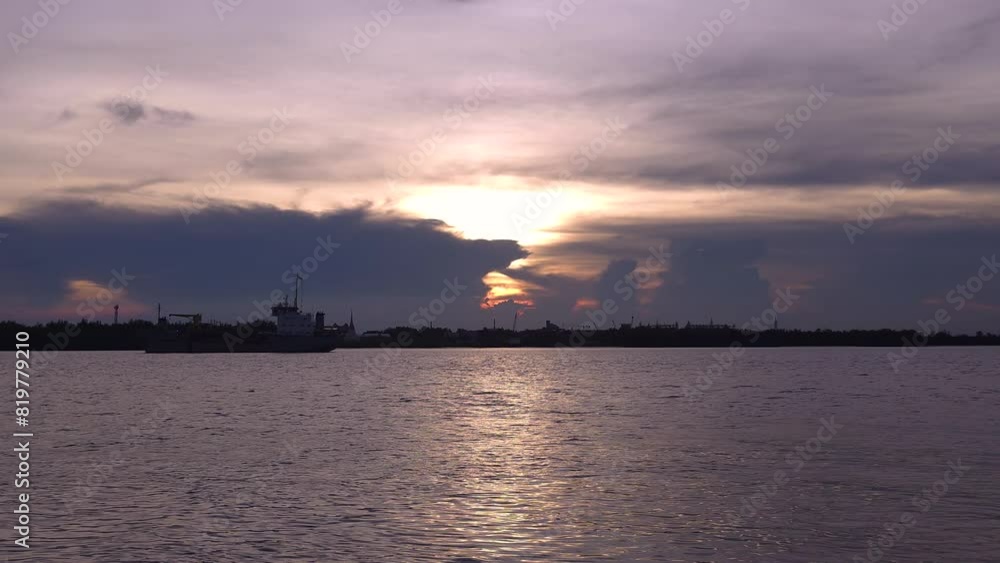 Serene Sunset over the River with Silhouetted Skyline Serene Sunset over the River with Silhouetted Skyline