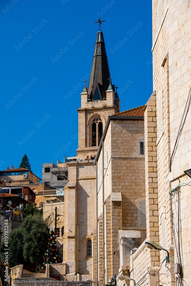 Fototapeta premium Picturesque street of stone buildings in the streets of Nazareth, Galilee, Israel.