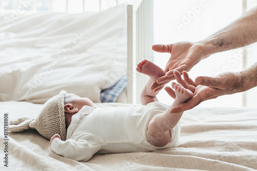 Gentle touch: Baby's first moments with parent photo