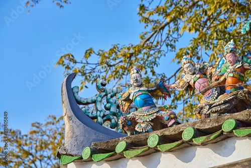 Colorful oriental sculptures on the rooftop. Chaoshan, China. photo