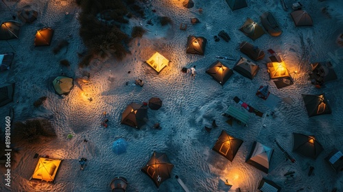 A captivating aerial view of a beach at night with a string of lanterns illuminating the waters edge  creating a magical atmosphere under the cover of darkness AIG50