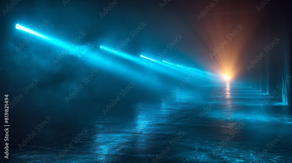 Fototapeta premium Blue and yellow beams of bright laser light shining on black background 