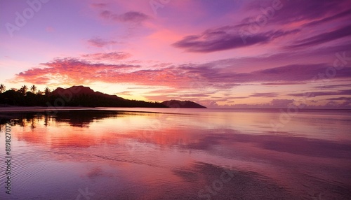 pinkish purple sunrise colors reflecting in the water in fiji