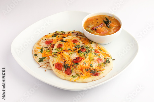 Uthappam or uttapam is a type of dosa from South India which is thicker, with tomato, onion and chilli toppings