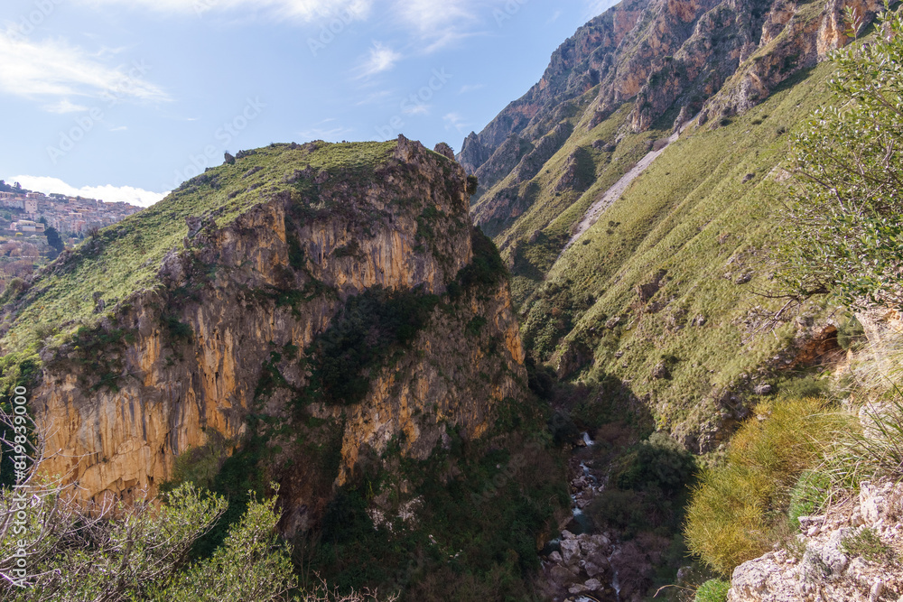 View of Rock with canyon and small creek at the Madonie Natural Park on a sunny day, Isnello, Sicily, Italy View of Rock with canyon and small creek at the Madonie Natural Park on a sunny day, Isnello, Sicily, Italy