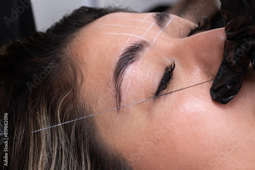 Precision Eyebrow Threading at a Wellness Center photo