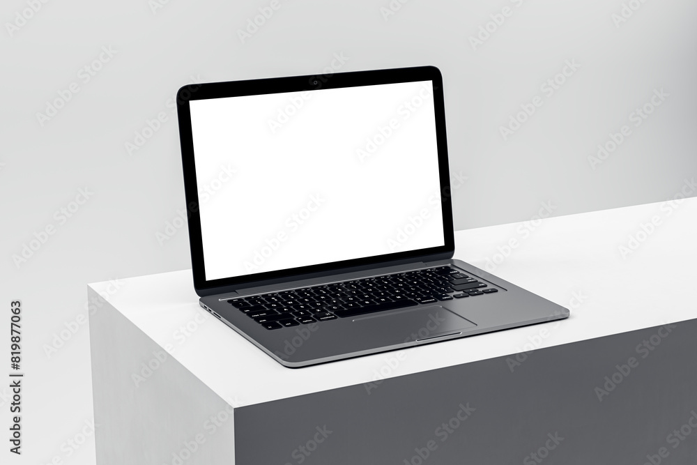 Elegant laptop on a clean white pedestal, featuring a blank screen for advertising and professional display. 3D Render Elegant laptop on a clean white pedestal, featuring a blank screen for advertising and professional display. 3D Render