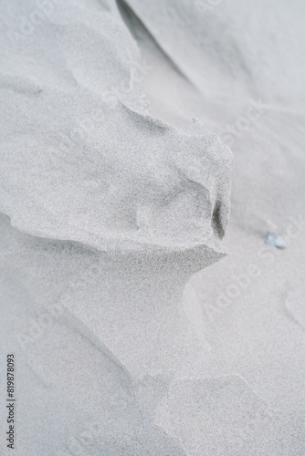 Dune Sand Ripple Closeup Texture in Cold Winter Morning Sunlight with Shallow Depth of Field