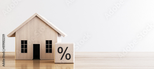 Simple wooden house and percentage block, depicting concepts of mortgage and interest rates. 3D Render