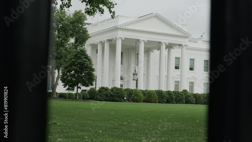 The White House in Washington DC seen through fence around the house