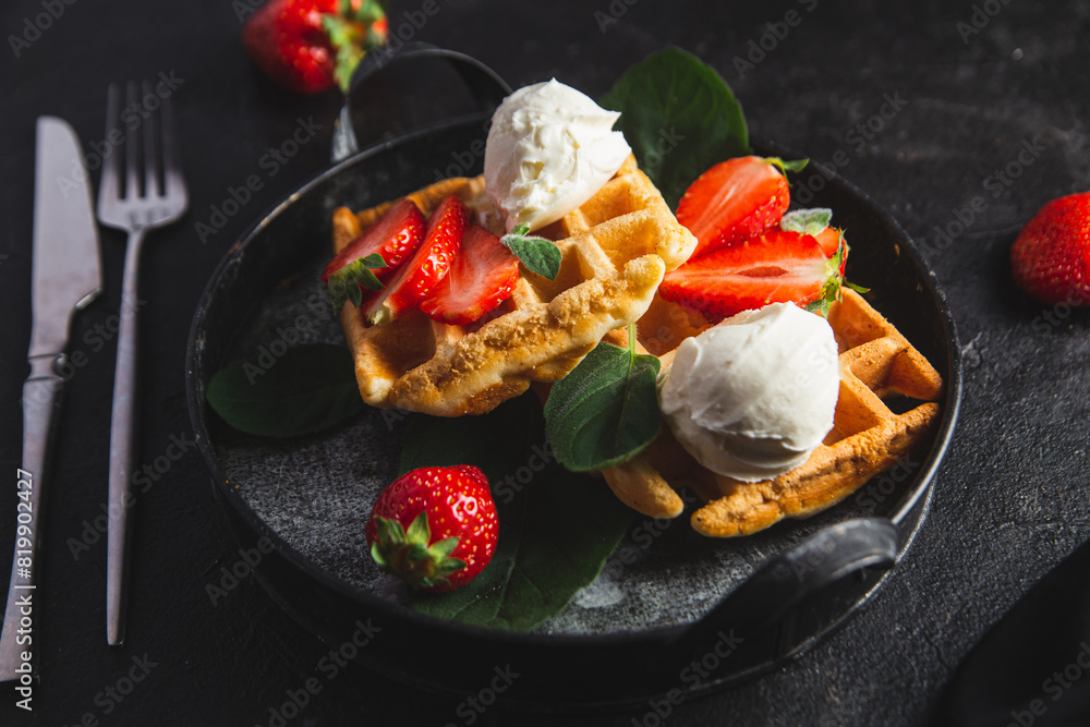 Belgian waffles with strawberries and ice cream Belgian waffles with strawberries and ice cream