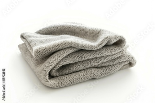 Neatly folded towels on a clean white surface, perfect for household or spa concepts