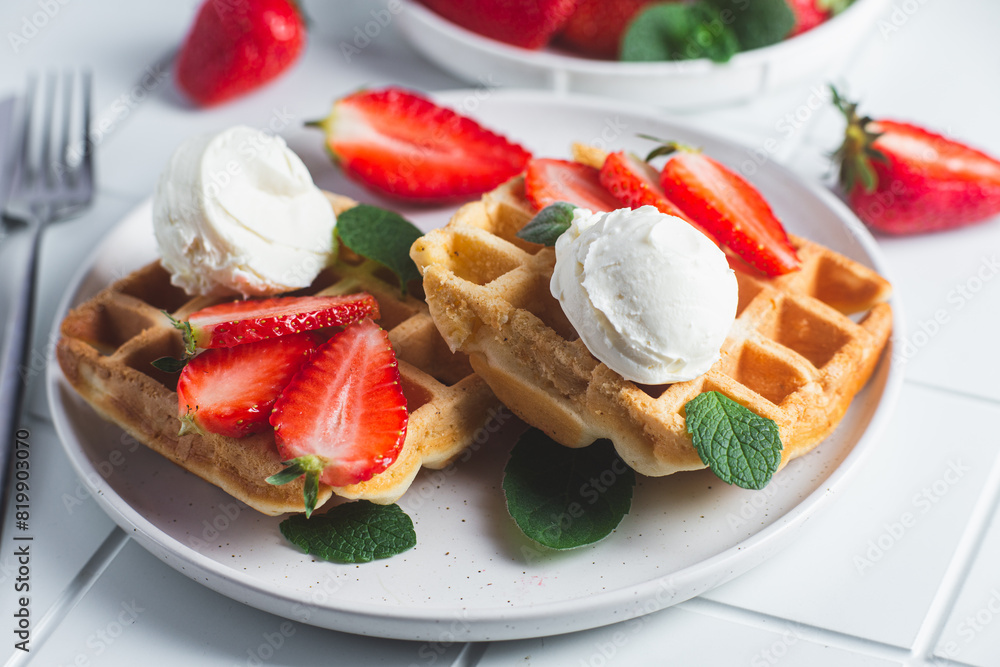 Belgian waffles with strawberries and ice cream Belgian waffles with strawberries and ice cream