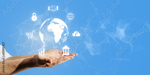 A hand with digital icons and a world map connection network on a blue background  representing global technology concept