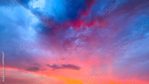 Panorama. Sky with clouds during sunset. Nature. Clouds and blue sky. A high-resolution photograph. Panoramic photo for design and background.