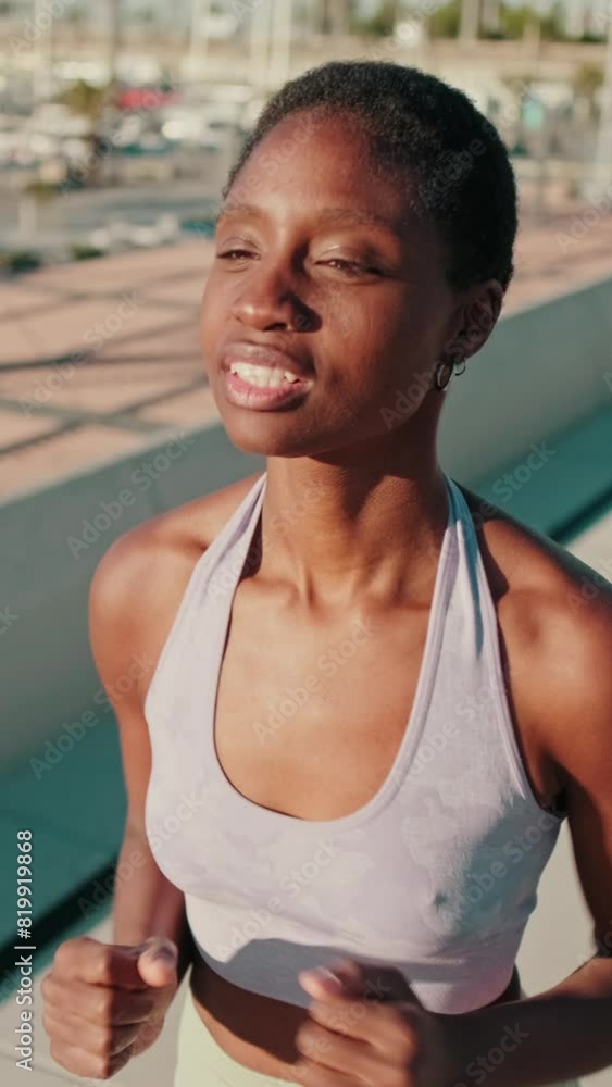 Portrait of a fit girl in sportswear doing street workout, running along the sea Portrait of a fit girl in sportswear doing street workout, running along the sea