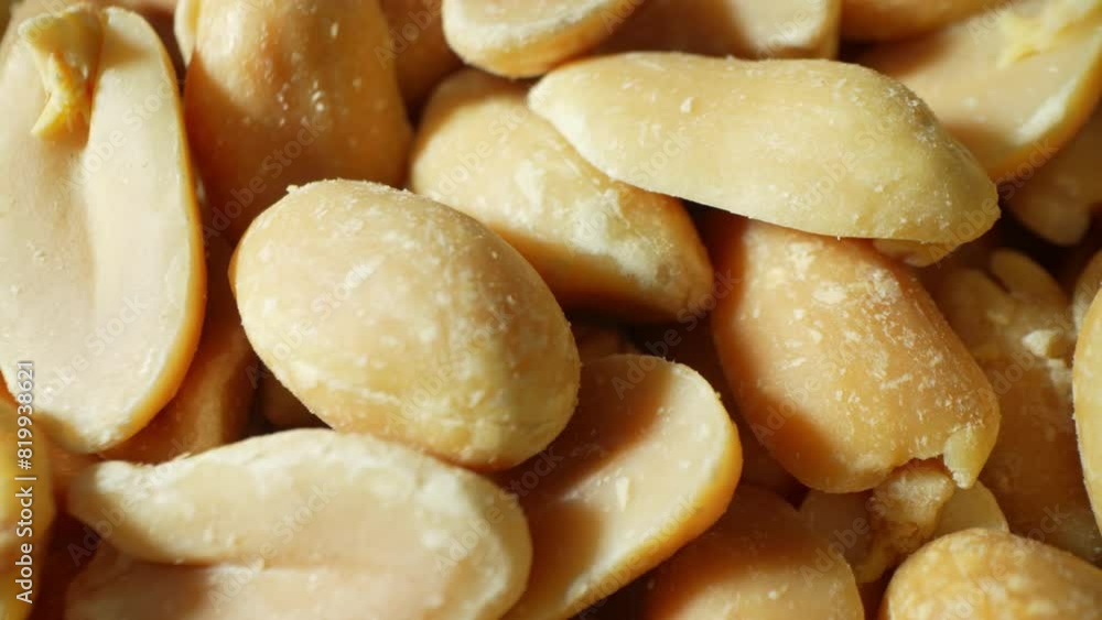 A close-up reveals the allure of roasted peanuts, golden-brown and glistening, their halves unveil a smooth, oily interior. Each with its distinct two-lobed shape, promising crunchy delight.
A close-up reveals the allure of roasted peanuts, golden-brown and glistening, their halves unveil a smooth, oily interior. Each with its distinct two-lobed shape, promising crunchy delight.