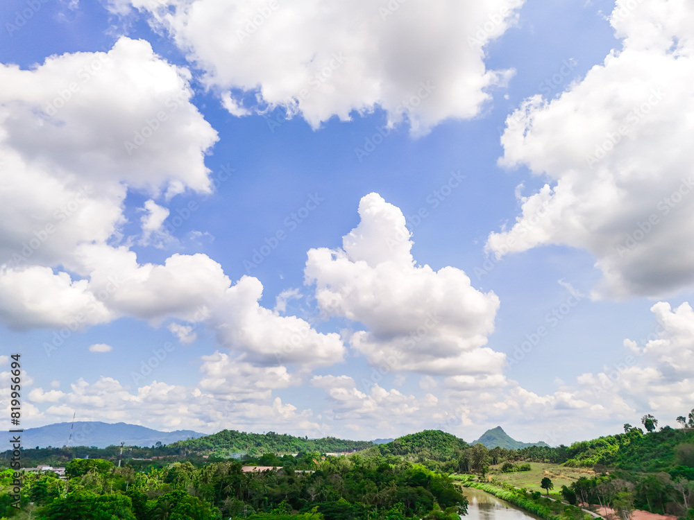 Blue sky background with clouds and forest. Bright sky and clouds of the day. Rain wood nature. Long holiday, background for relaxation mood Relaxation. Blue sky background with clouds and forest. Bright sky and clouds of the day. Rain wood nature. Long holiday, background for relaxation mood Relaxation.