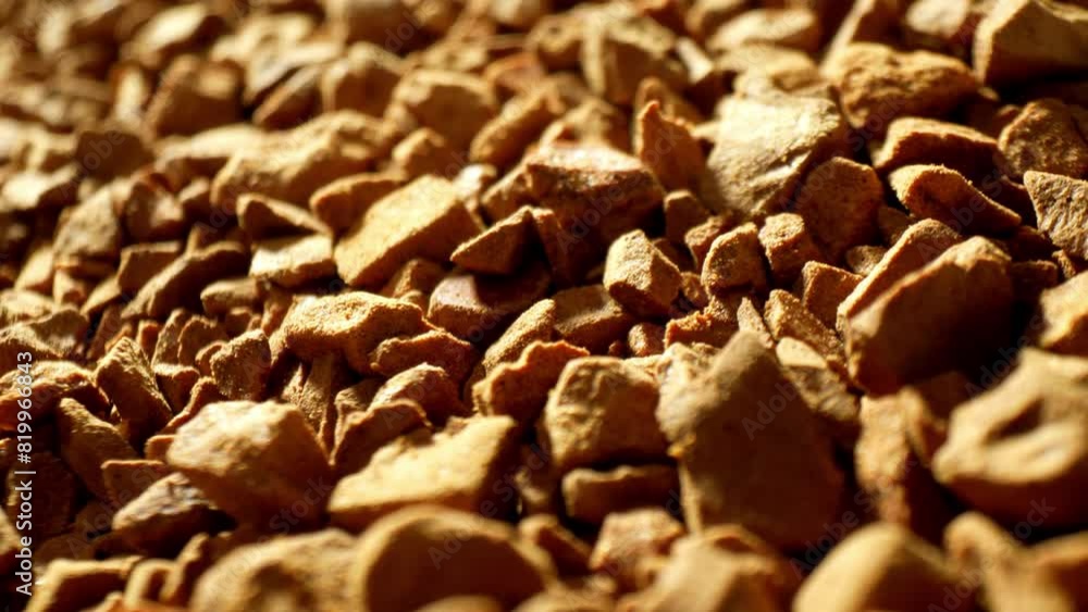 In the intimate close-up of freeze-dried coffee, warm light dances, casting gentle shadows, revealing a mesmerizing mosaic of golden-brown fragments, reminiscent of rugged gemstones.
In the intimate close-up of freeze-dried coffee, warm light dances, casting gentle shadows, revealing a mesmerizing mosaic of golden-brown fragments, reminiscent of rugged gemstones.
