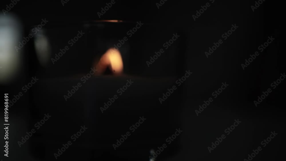 Candle light in the dark in church. Flickering Candle. Spiritual Atmosphere Candle light in the dark in church. Flickering Candle. Spiritual Atmosphere