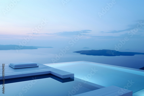 View from the infinity pool with contemporary design over a sunset landscape of sea and mountains © Myroslava