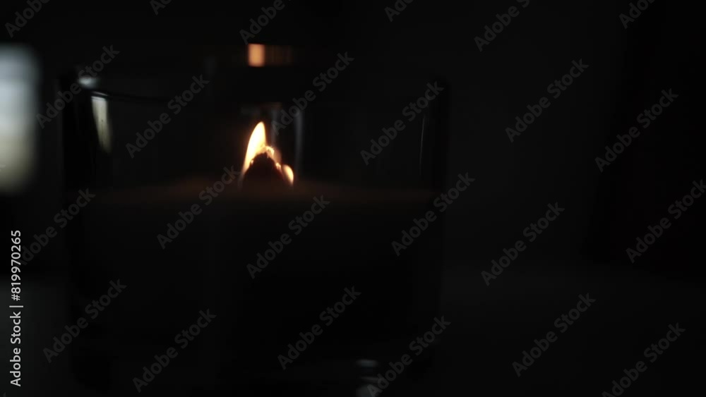 Candle light in the dark in church. Flickering Candle. Spiritual Atmosphere Candle light in the dark in church. Flickering Candle. Spiritual Atmosphere