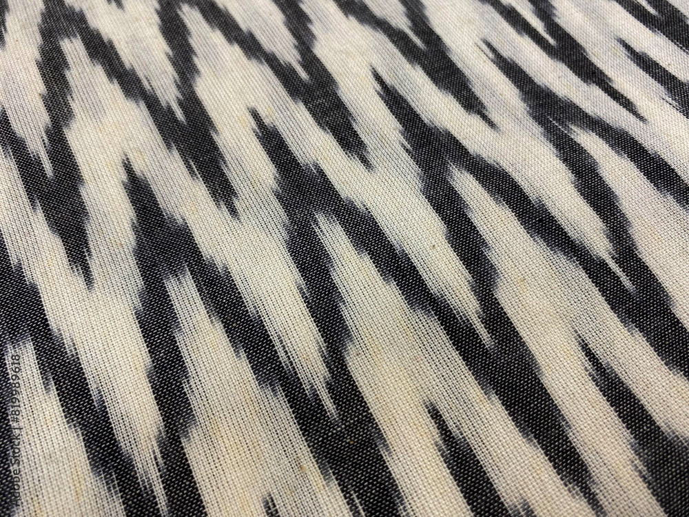 Closeup of black and white zigzag woven ikat on cotton fabric Closeup of black and white zigzag woven ikat on cotton fabric