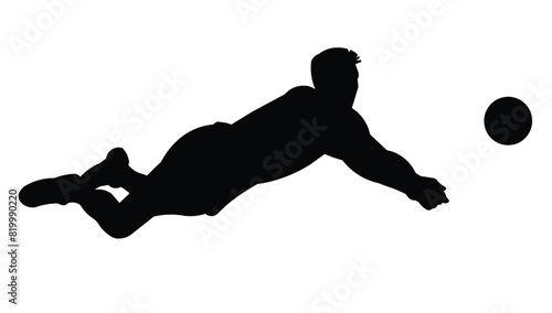 Black silhouette of a volleyball player falling and going for a dig to hit the ball