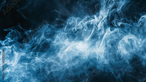 blue smoke swirling. Ethereal blue smoke swirling and twisting against a dark background, creating a mystical atmosphere. photo