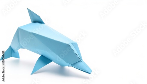 Animal concept origami isolated on white background of a bottle nose dolphin porpoise - Tursiops truncates - with copy space side view of fins, tail, face, simple starter craft for kids photo