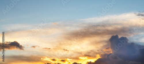 Sky background. Bright orange sunset sky with clouds.  © Inga Av