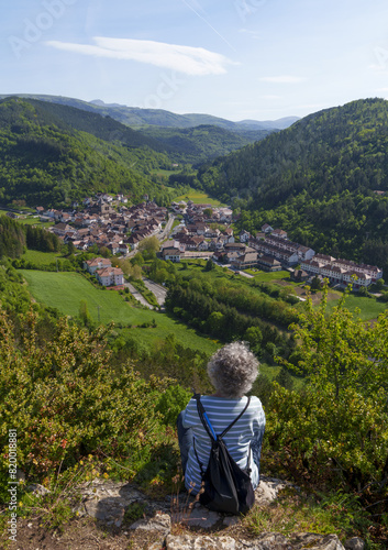 Woman looking at Otsagabia. Hiker at the viewpoint of Marta, Otsagabia, Navarra.