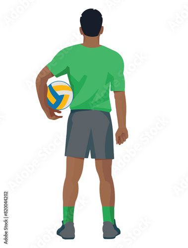 African volleyball player from the back who stands with a ball under his arm